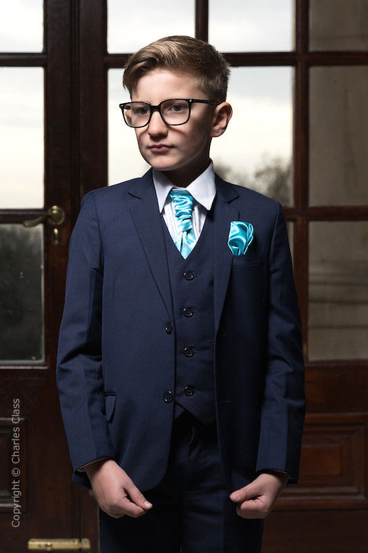 navy blue suit with turquoise tie